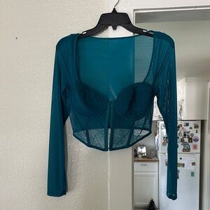 Beautiful lace and sheer long sleeve bustier top. Size medium.